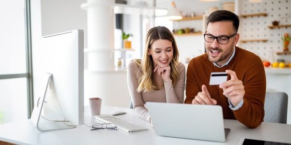 portrait-of-a-cheerful-couple-shopping-online-tec-2021-08-29-11-44-57-utc-scaled.jpg